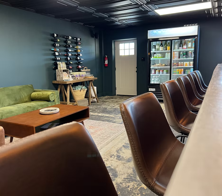 Inside The Cape: leather bar stools, lounge seating, wine display and beverage cooler